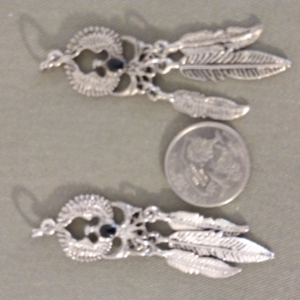 Native American appears to be Sterling silver Eagle pendants